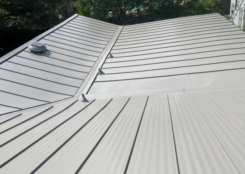 Solar attic fan installed on a metal roof for Roof Ventilation in Palmer Town